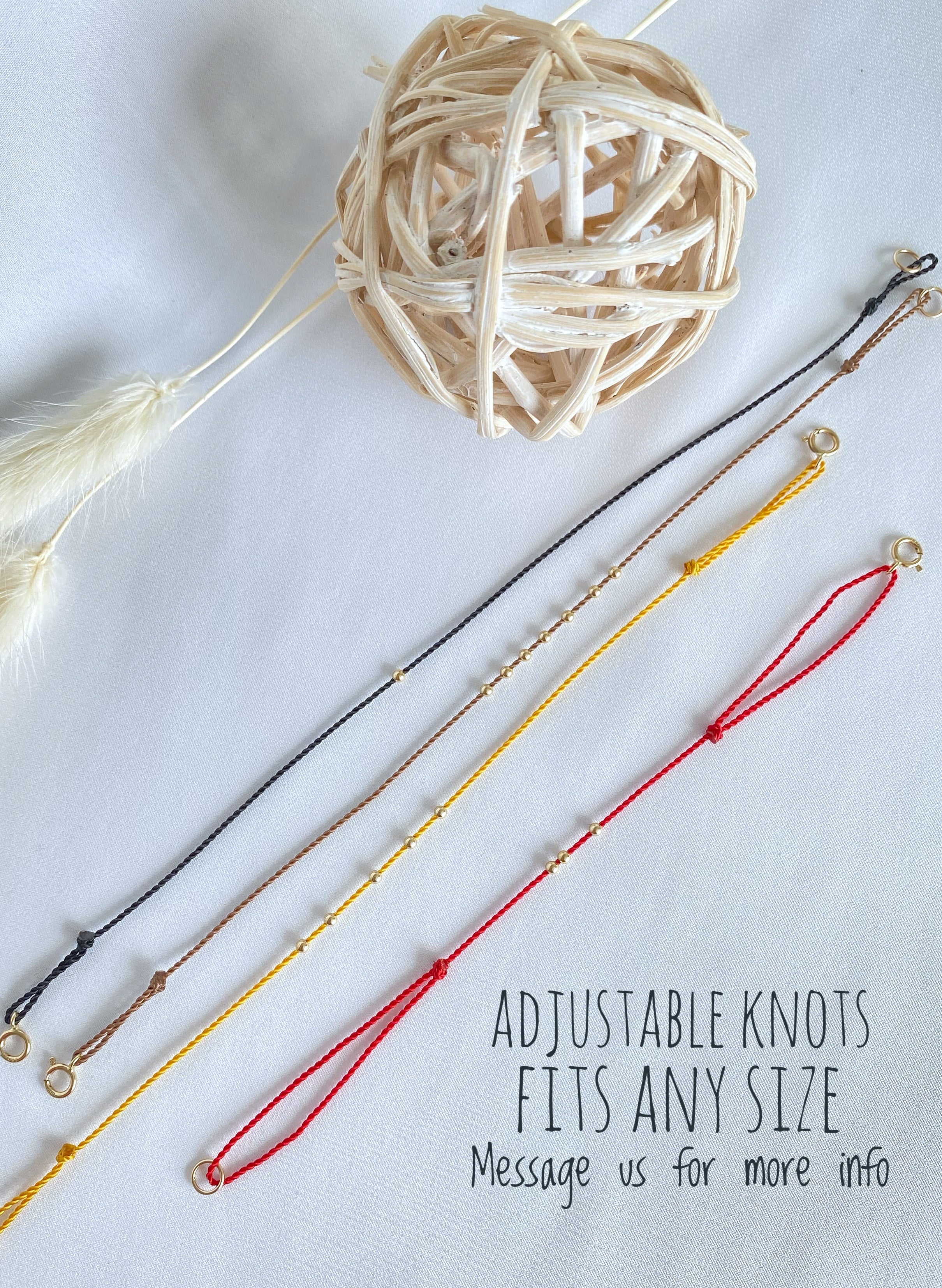 Three gold beads - spring ring