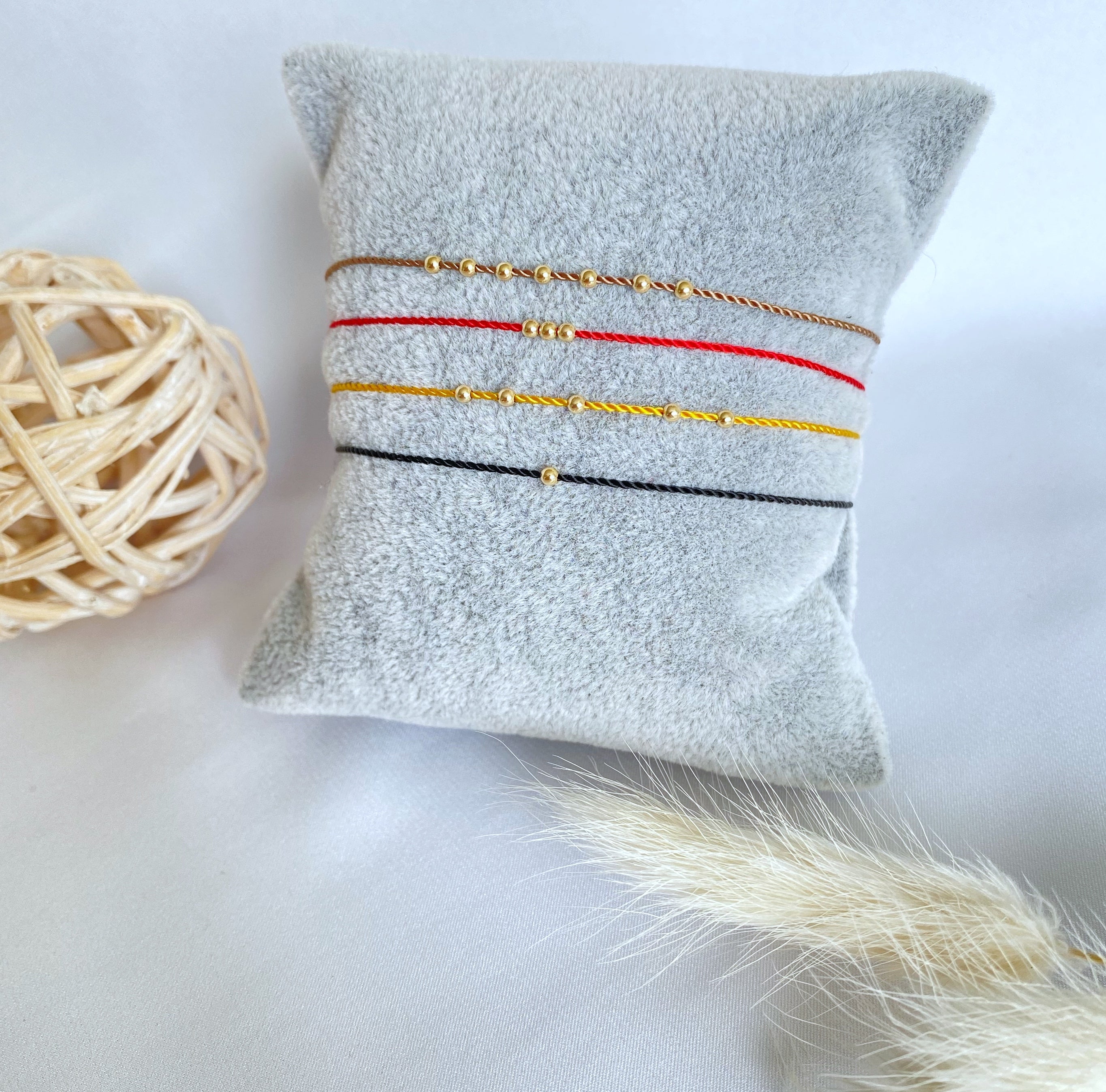 Three gold beads - spring ring