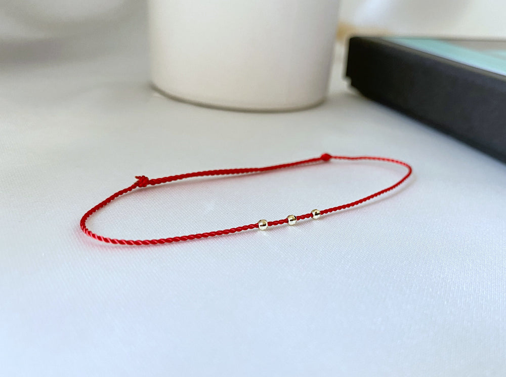 red bracelet - 14k gold beads